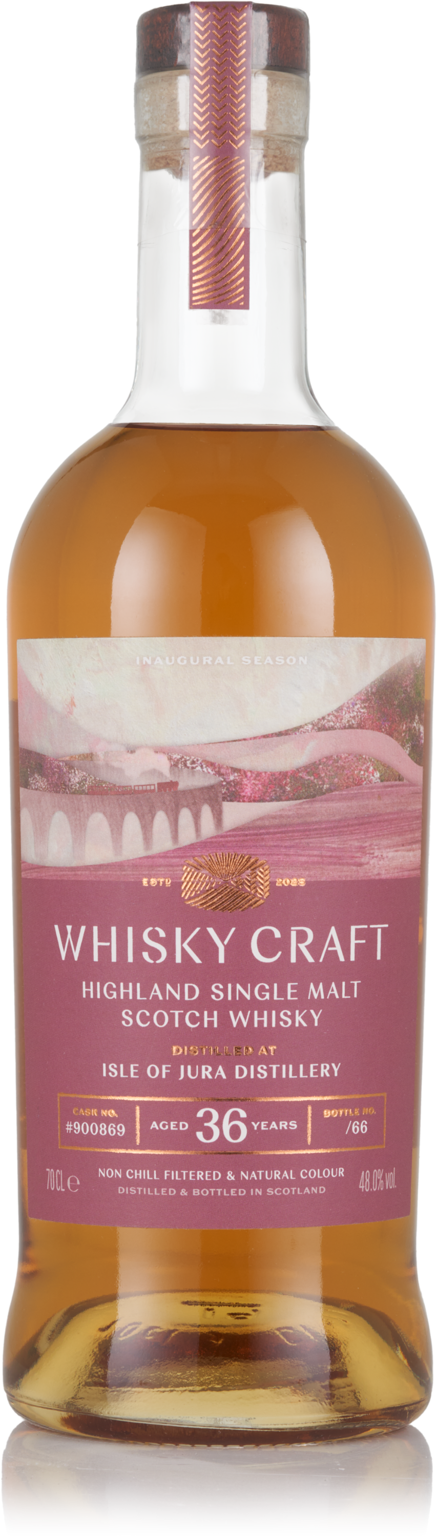Bottle of Whisky Craft Highland Single Malt Scotch Whisky. It's aged 36 years, has a purple mountain illustration, and the liquid is a medium-warm brown colour.